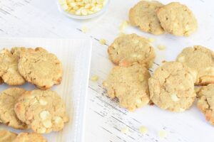 Keto Macadamia Nut Cookies with White Chocolate Chips on a white plate.