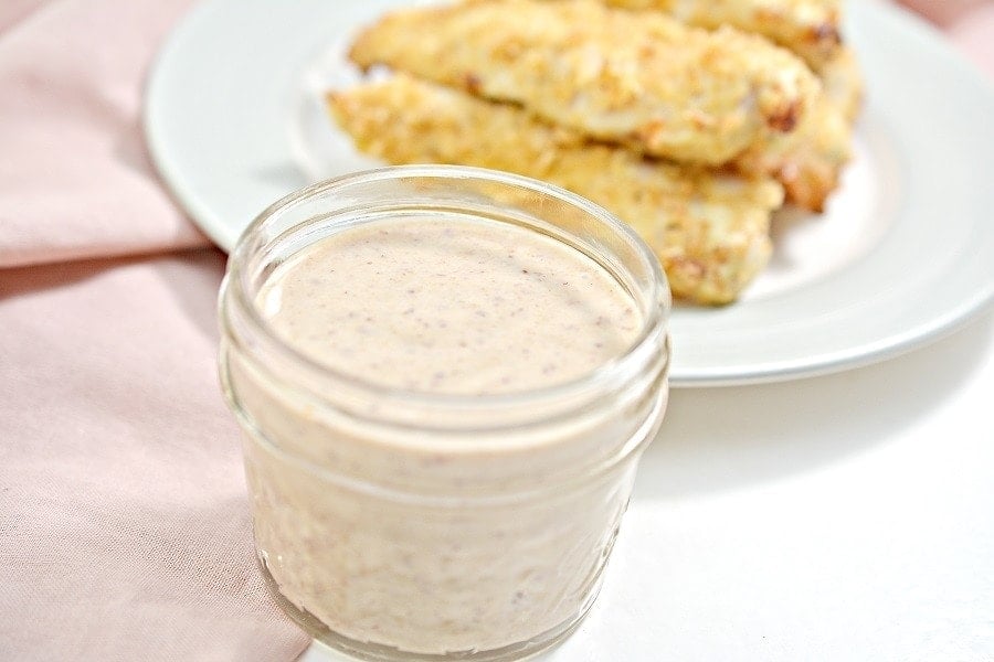 Copycat Chic Fil A Sauce with chicken strips.