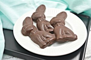 3 Keto Chocolate Bunnies on a white plate.