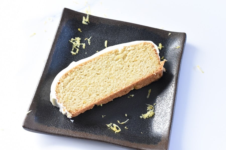 Keto Lemon Loaf on a black plate.