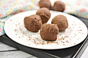 4 Chocolate Keto Truffles on plate.