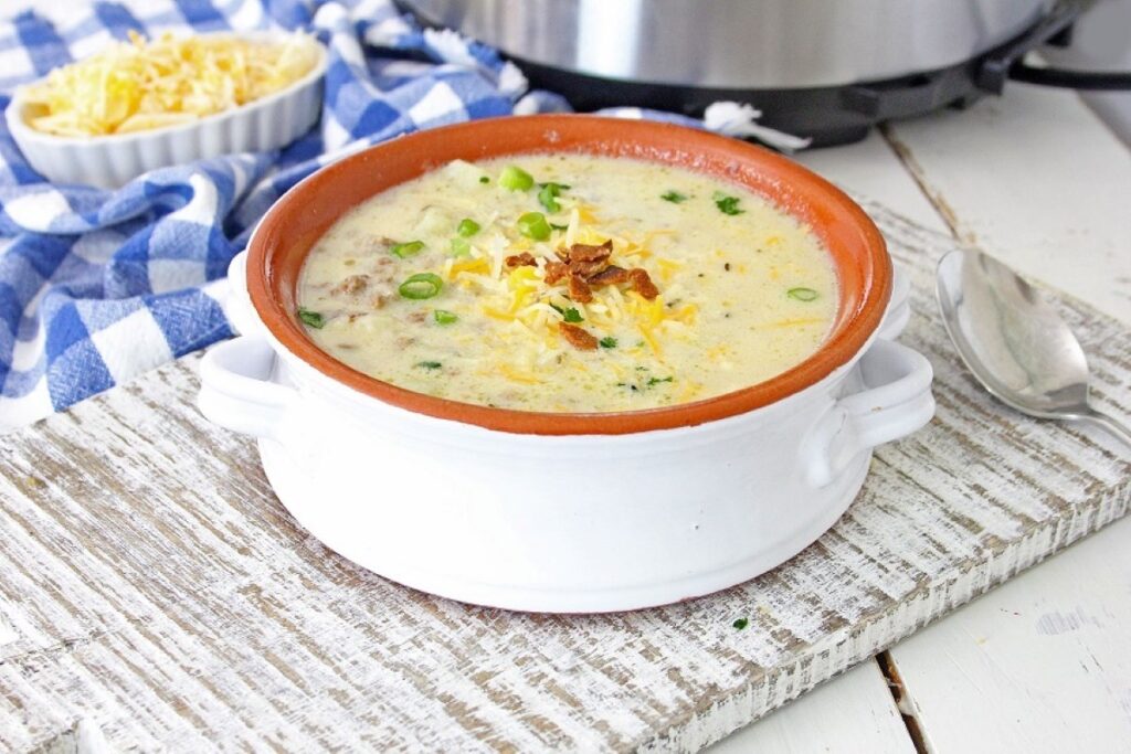 Cheeseburger Soup in a white bowl.