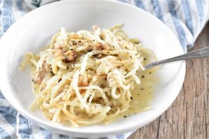 Chicken Tetrazzini in a white bowl.
