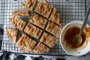 Peanut butter bars on a wire rack.