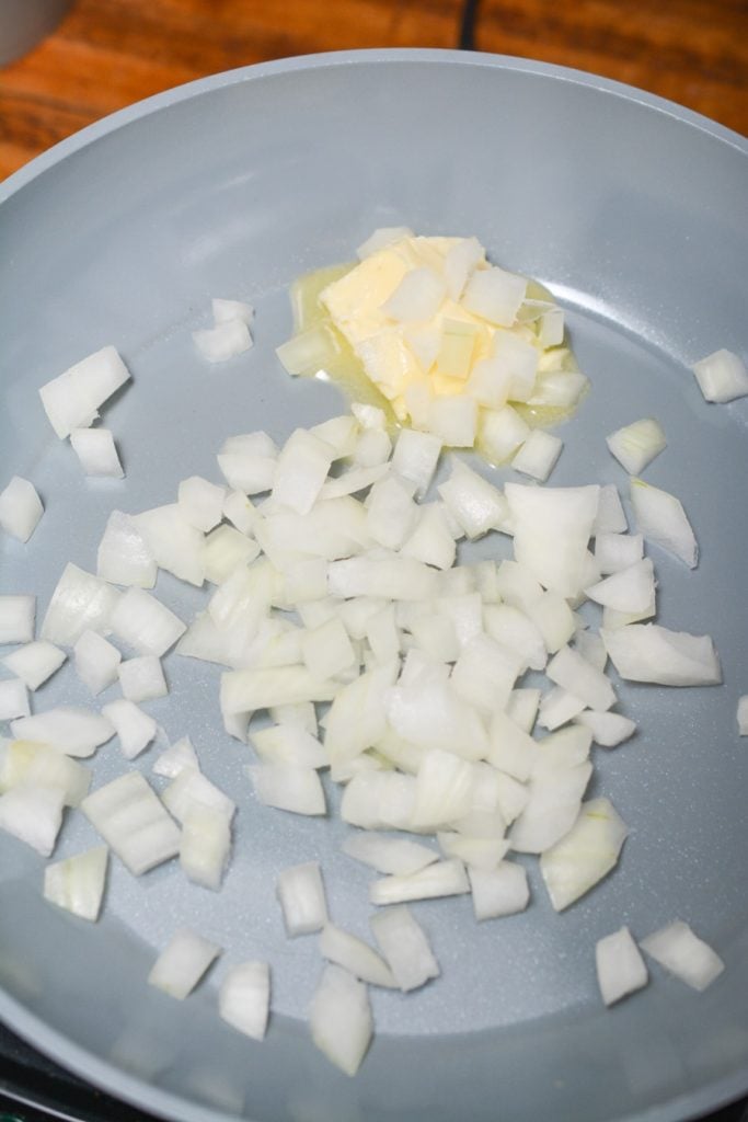 Onions cooking in a pan.
