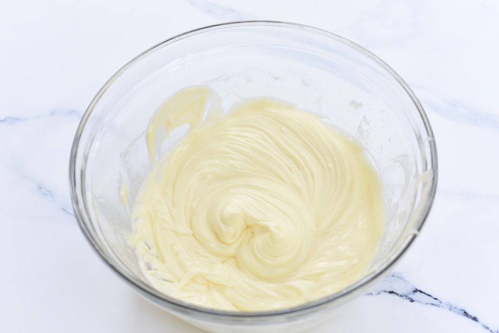 Cream cheese frosting in a mixing bowl.