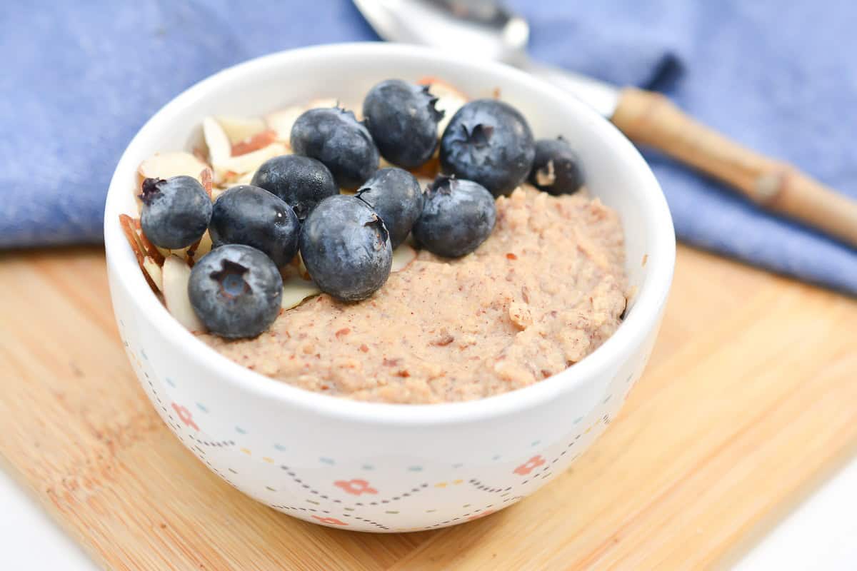 Oatmeal with blueberries in a white bowl.