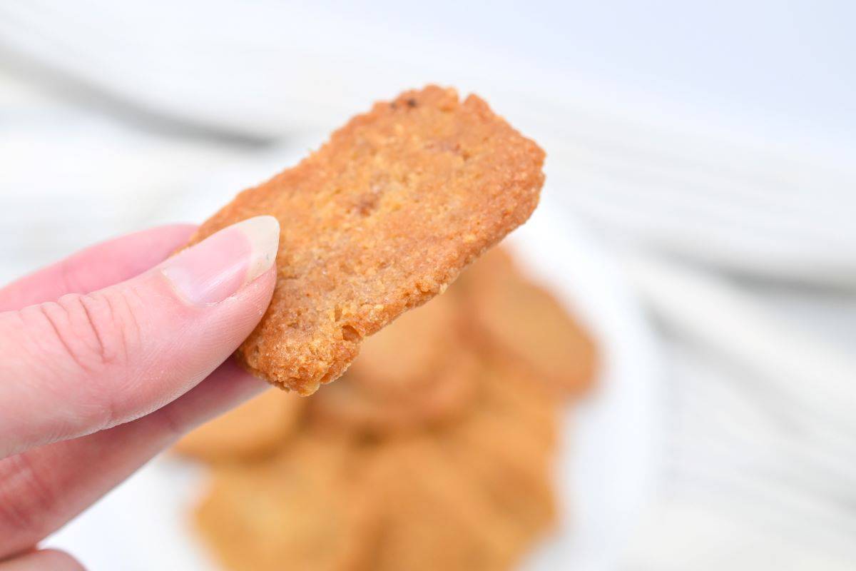 A woman holding a Carnivore Cracker.