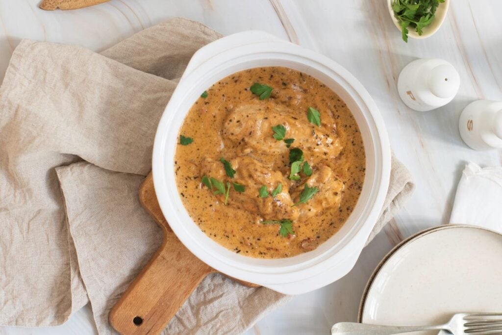 A bowl of Marry Me Chicken in a white bowl.