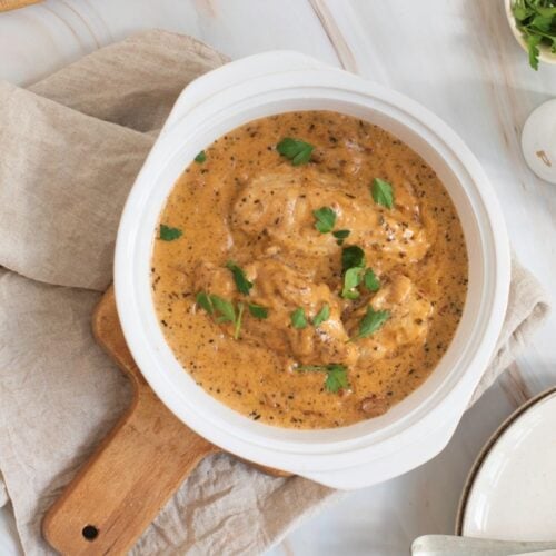 A bowl of Marry Me Chicken in a white bowl.