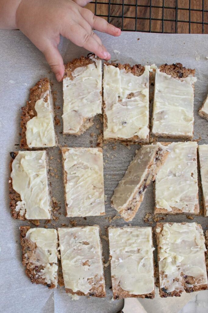 A hand grabbing a Magic Cookie Bar.