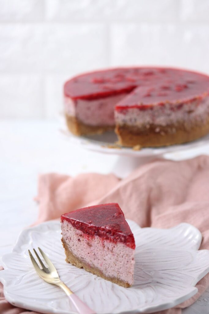 Keto raspberry cheesecake on a plate.