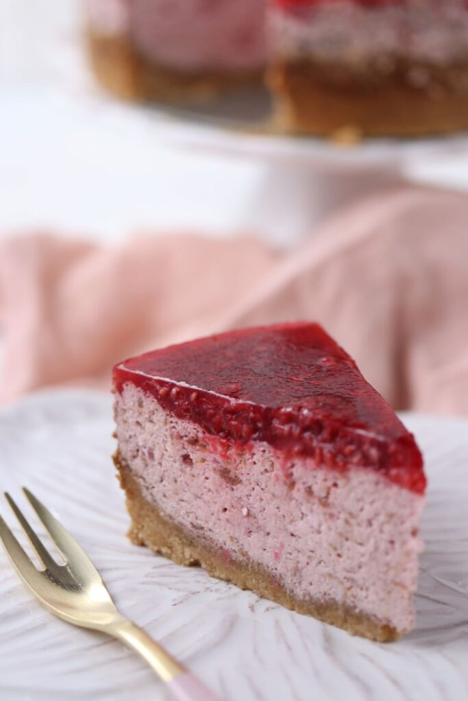 Keto raspberry cheesecake on a plate.