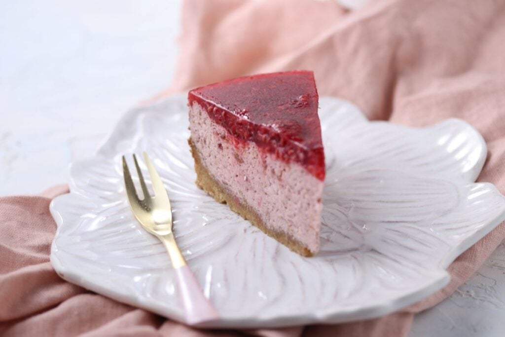 Keto raspberry cheesecake on a plate.
