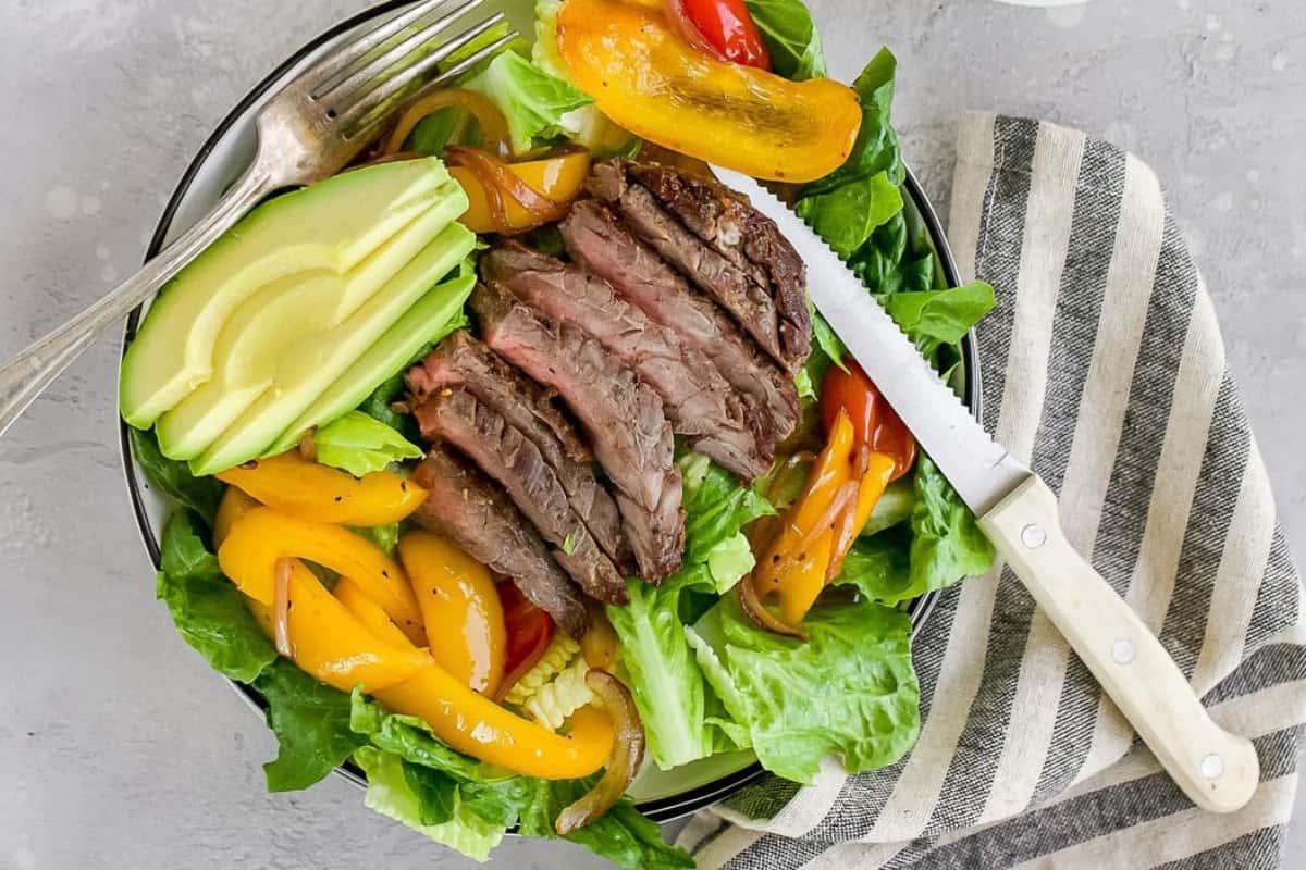 Fajita Steak Salad with a gray and white napkin.