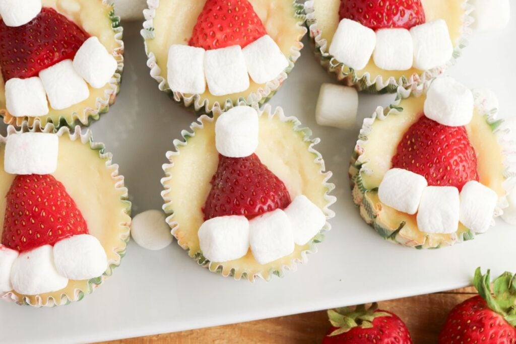Mini Keto Santa Cheesecakes on a white platter.