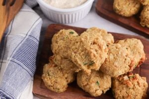 Mini Keto Crab Cakes on a wooden plate.