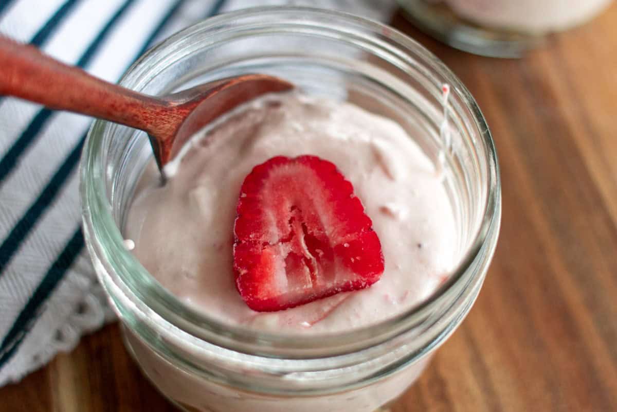 Strawberry Cheesecake in a mason jar.