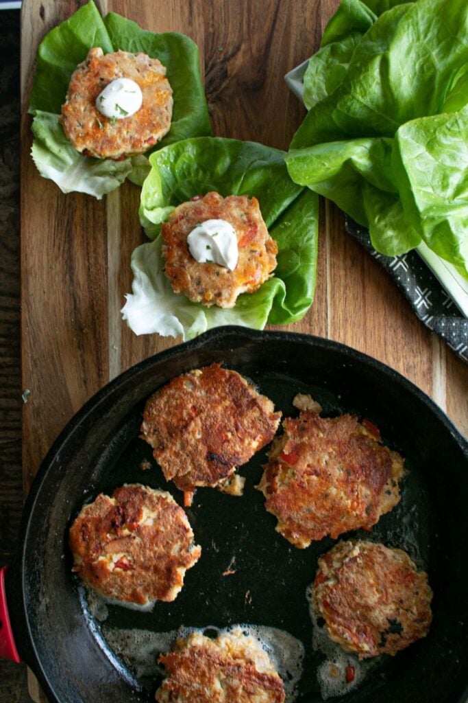 Keto Tuna Cakes in a pan and lettuce wrap.